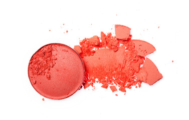 Smear of crushed orange eyeshadow as sample of cosmetic product