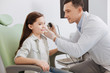 © Viacheslav Yakobchuk - Young ear nose throat doctor doing hearing exam of girl