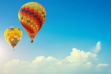 Two Colorful Hot Air Balloons Up In The Beautiful Blue Sky With Cloud. Travel Background Concept With Free Space For Text. Fresh Nature And Relax Vacation.