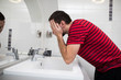 © F8  \ Suport Ukraine - Handsome man washing face in bathroom in morning
