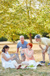 © Robert Kneschke - Seniors as friends making a picnic