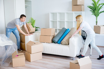 Couple carrying sofa