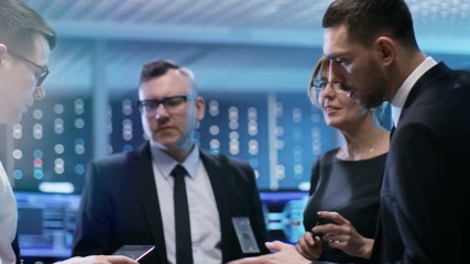 Aufkleber - Team of Chief Engineers Have Emergency Meeting in System Controls Center. They Consult Data on Tablet Computer and Analyse it.  Shot on RED EPIC-W 8K Helium Cinema Camera.