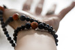 Woman's hand with a mala bracelet 