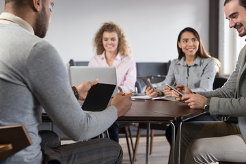 Canvas Print - Businesspeople Group In Coworking Center Diverse Mix Race Team Coworkers Working Meeting Brainstorming Modern Office