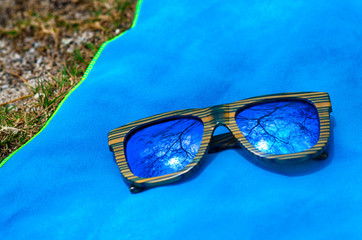 Fashion sunglasses on blue towel