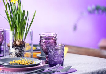 Beautiful table setting on color background