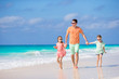 © travnikovstudio - Family walking on white tropical beach on caribbean island