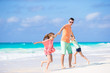 © travnikovstudio - Happy family at tropical beach having fun