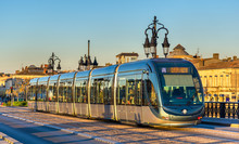 City Tram On Pont De Pierre Bridge In Bordeaux, France
