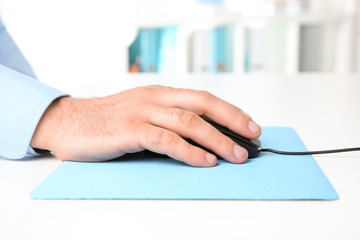 Sticker - Hand of man working with computer mouse in office