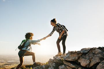 Wall Mural - two young women hiking in nature
