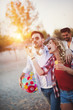 © NDABCREATIVITY - Young people having fun at beach in summer