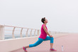 © .shock - woman stretching and warming up on the promenade