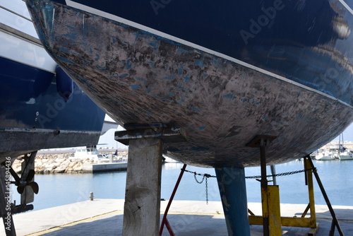 Fotografia, Obraz stilts holding a boat for maintenance and repair
