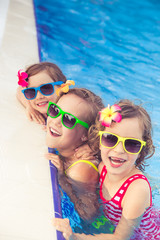 Wall Mural - Happy children in the swimming pool