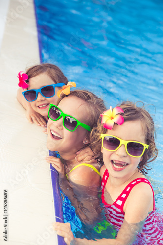 Happy children in the swimming pool