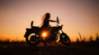 Silhouette of girl on a motorcycle,
