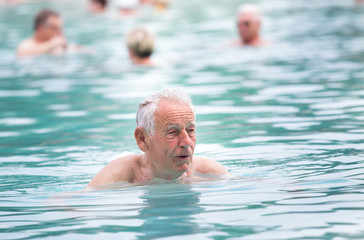 Senior man in swimming pool