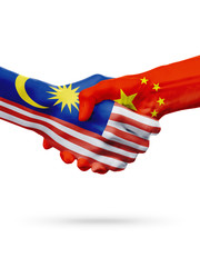 Wall Mural - Flags Malaysia, China countries, partnership friendship handshake concept.