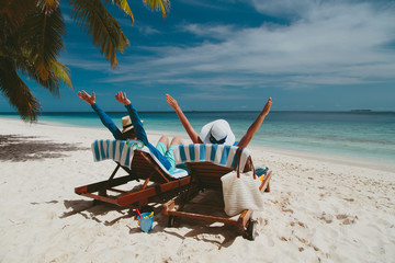 Wall Mural - happy couple relax on a tropical beach