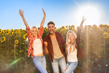 Sticker - People group friends outdoor countryside sunflowers field blue sky two couple happy smile, summer sunny day