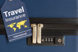 © William W. Potter - Travel insurance label is put near a numeric combination locks.