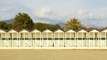 Wall Mural - sea cabins view on versilia beach on sunset