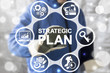 © wladimir1804 - Strategic Plan Industrial Concept. Industry 4 planning and strategy. ERP enterprise strategies resource web finance manufacturing technology. Worker touched icon strategic plan word on virtual screen.