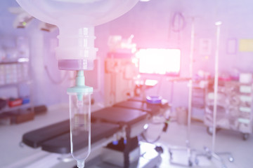 Close up 0.9 % Normal saline solution or sodium chloride drip for patient and infusion pump at Emergency ,operating room in hospital by doctor,Medical corridor concept,with copy space ,vintage color