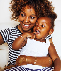 adorable sweet young afro-american mother with cute little daugh