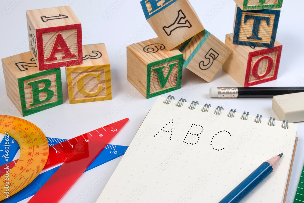 Stock-Foto „Wood letter blocks alphabet ABC with notebook worksheet for ...