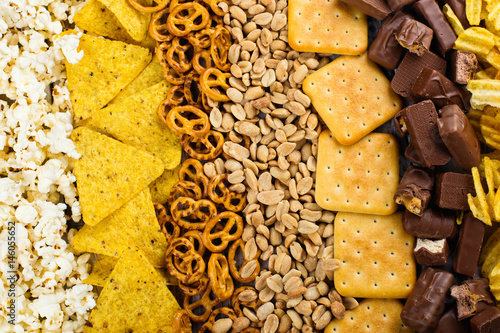 Cuadros en Lienzo Unhealthy snacks on wooden background