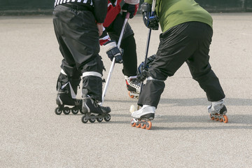 two forwards waiting for the ref to drop the puck