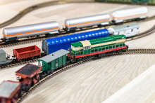 Green Model Diesel Engine Pull Freight Train On Light Wooden Floor, Playtime For Kids And Adults