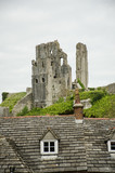 Corfe Castle with village roofs in foreground