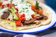 Gyros with vegetable, meat and tzatziki sauce