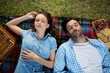© WavebreakMediaMicro - Couple sleeping on picnic blanket