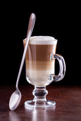 Wall Mural - coffee latte macchiato on a black background