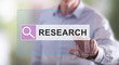 © thodonal - Man touching a research concept on a touch screen