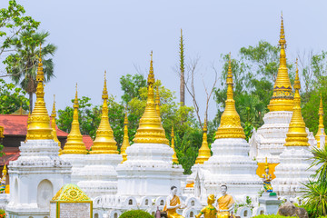 Wall Mural - Golden white Pagoda in Thai Buddha temple in Lampang Thailand