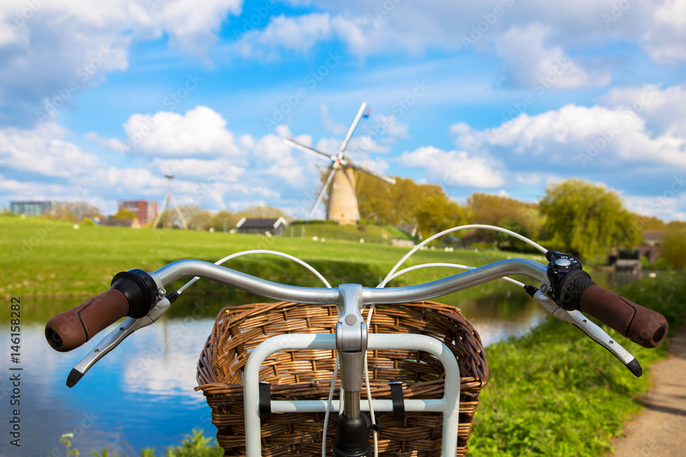Bicycle and windmill. Symbols of the Netherlands. - obrazy, fototapety, plakaty 