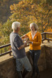 © WHL/Blend Images - Older Caucasian couple enjoying wine and scenic view