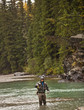© Mike Kemp/Blend Images - Caucasian man casting in river