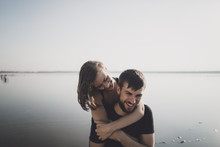 Caucasian Couple Hugging Near Lake