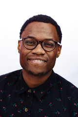 Wall Mural - attractive young black male studio smiling at camera