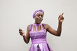 © verity jane smith/Blend Images - Black woman dancing to music on cell phone