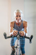 © Inti St Clair/Blend Images - Caucasian woman riding stationary bicycle