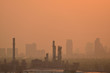 The oil refinery and cityscape in sunset time.