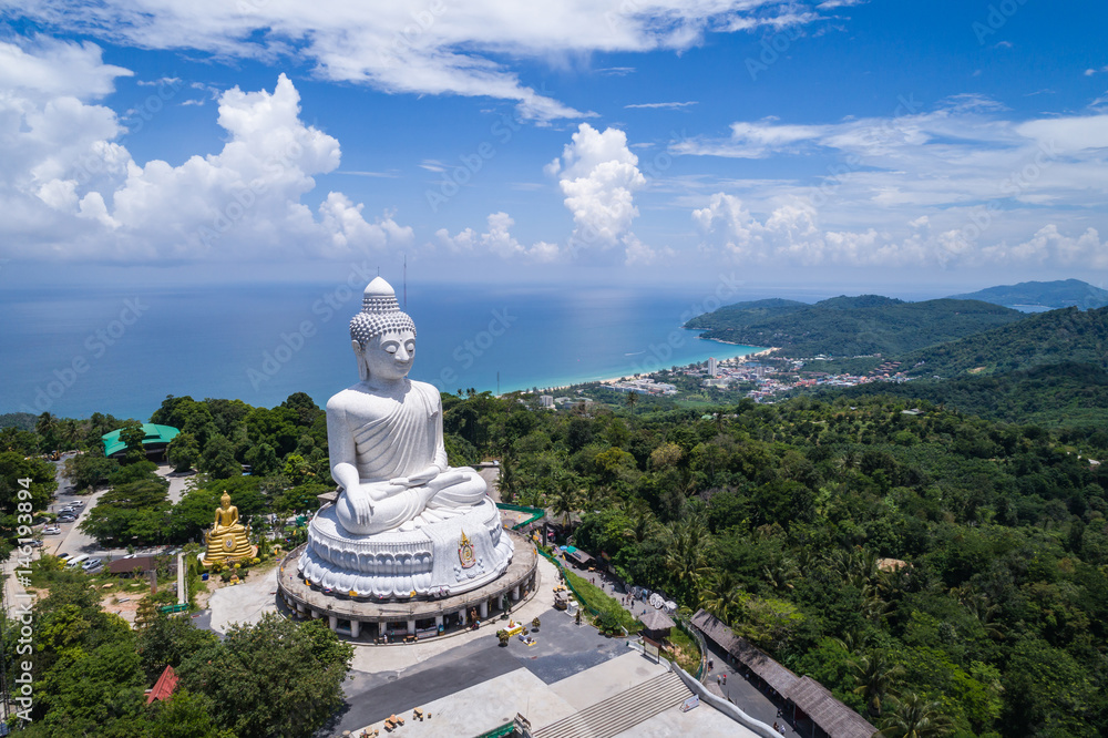 White buddha statue on top of the mountain with blue sky in Phuket - obrazy, fototapety, plakaty 